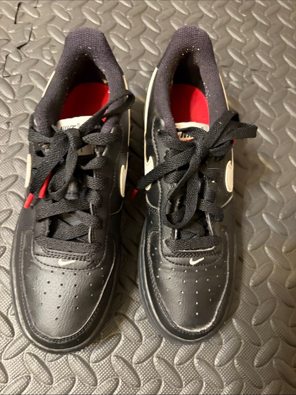 Nike Air Force 1 Low Kids Black Sneakers with White Swoosh and Red Interior